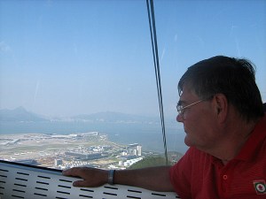 Mike trying to spot the airplane which had our Eventing horse passengers on their way back home